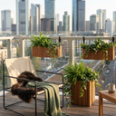 Self-watering wooden balcony planter mounted on railing with HoldON attachment