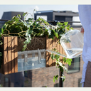 Minimalist self-watering planter box for balcony plants